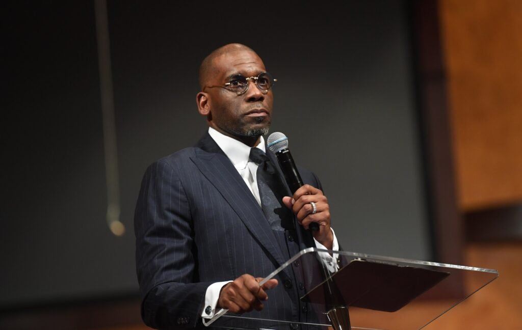 Pastor Jamal H. Bryant, senior pastor of New Birth Missionary Baptist Church, speaks onstage during TARGET FAST TownHall Meeting at Salem Bible Church on April 22, 2025 in Lithonia, Georgia. The "Target Fast" began as a 40-day fast from shopping at Target in response to the company’s rollback of its DEI initiatives.